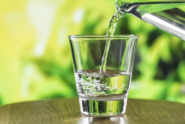 Water poured into a clear glass.