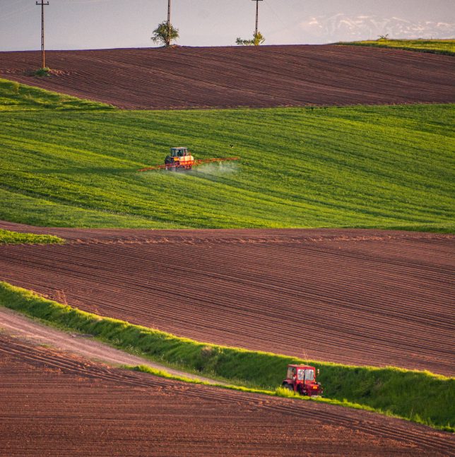 Tractor spraying on crops. Photo by Ferencz Istvan, Pexels.