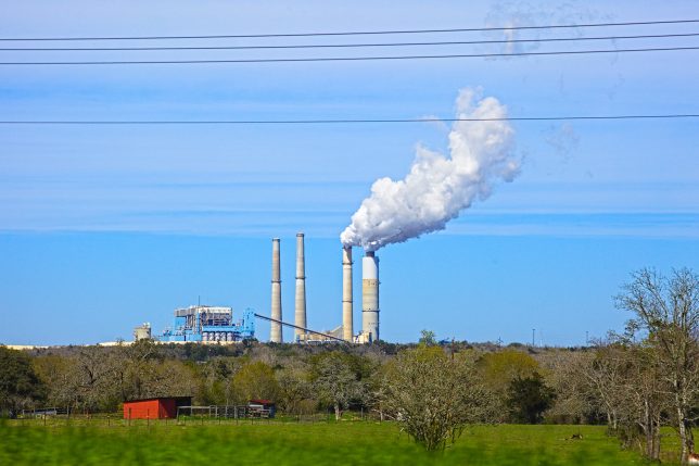 Fayette Power Project, a coal power plant near La Grange Texas, outside of Austin, in winter 2019. Fayette has been blamed for numerous pollution problems, and was one of the ERCOT plants that suffered failures due to cold weather in winter 2021. Photo by Sam LaRussa on Unsplash.
