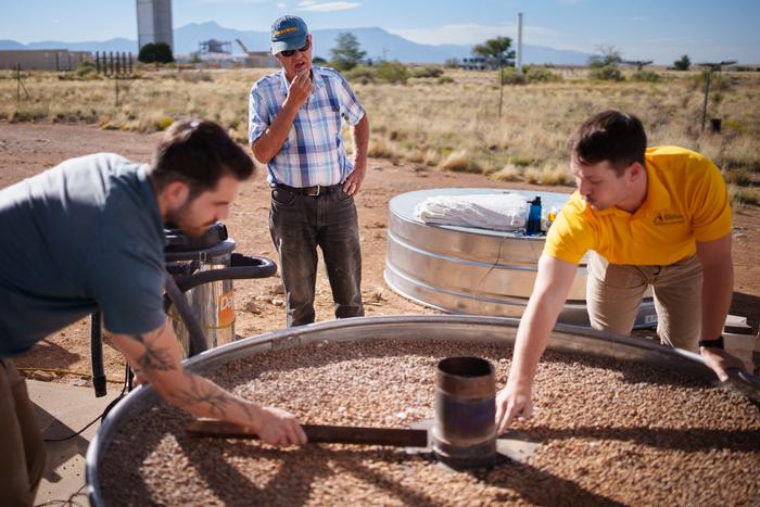 Nathan Schroeder, Walter Gerstle, and Luke McLaughlin discuss the design or an energy storage system that is being researched in by CSolPower and Sandia Labs. Photo by Craig Fritz.